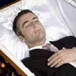 man in coffin