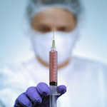 doctor with hypodermic needle