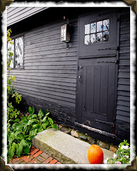 writing chair in front of cupboard