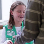 Girls Scout selling cookies